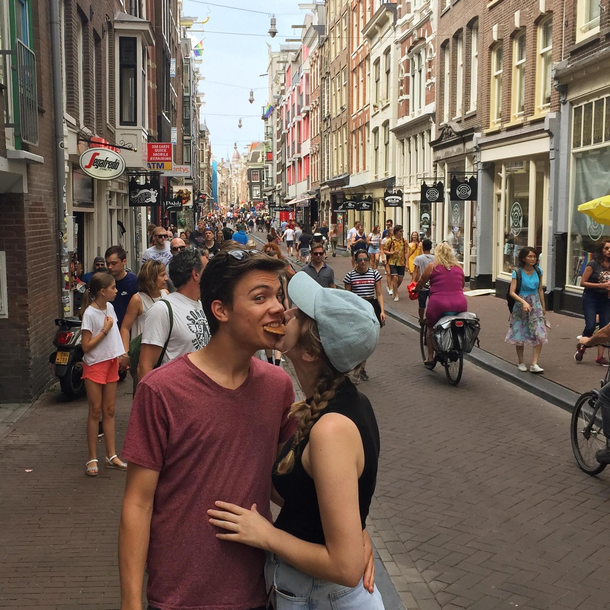 Sharing stroopwafels in the streets of Amsterdam