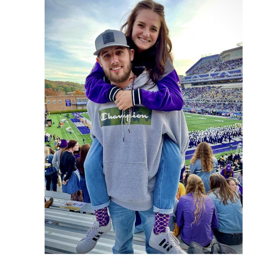 Our first photo together at a JMU football game. GO DUKES! 💜💛