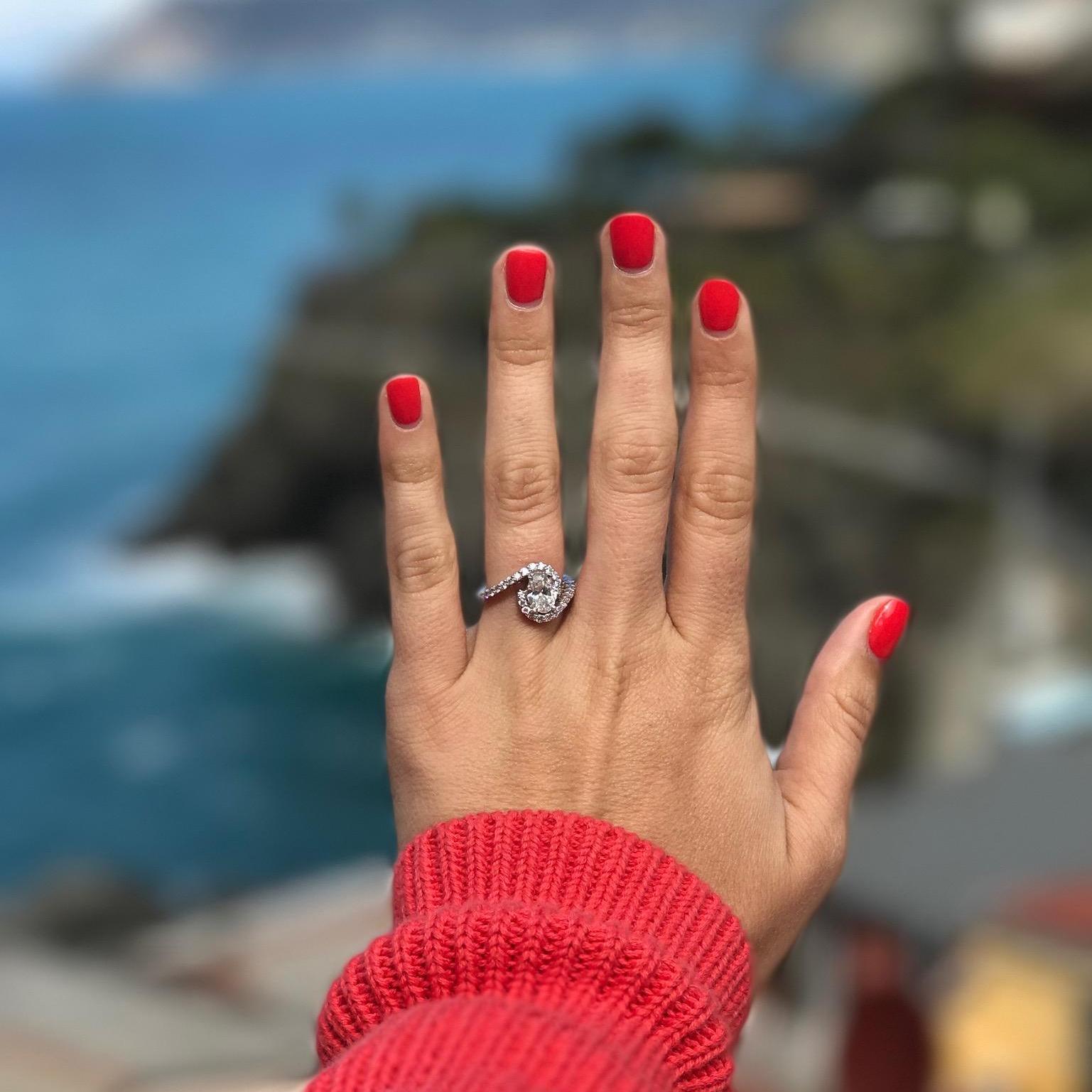 A shot of the ring right after the proposal! Check out the background--a view from their balcony in Cinque Terre.