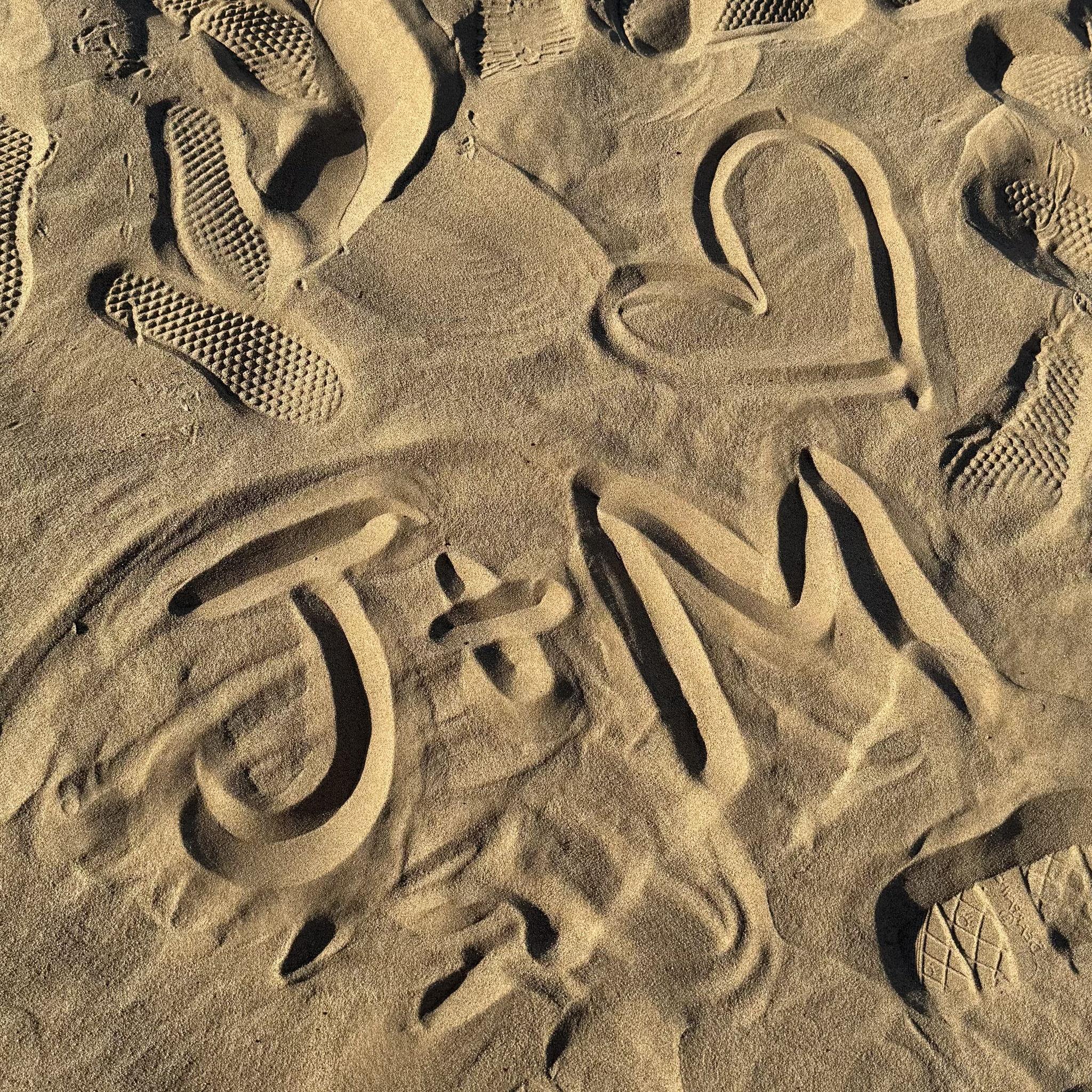Day before he proposed I wrote this in the sand