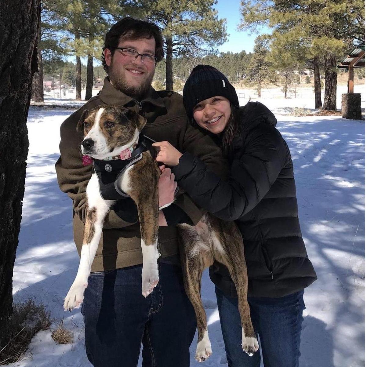 One of our first family photos back in February 2018 :) (Roxy was clearly thrilled to be dragged away from playtime for a photo!)
