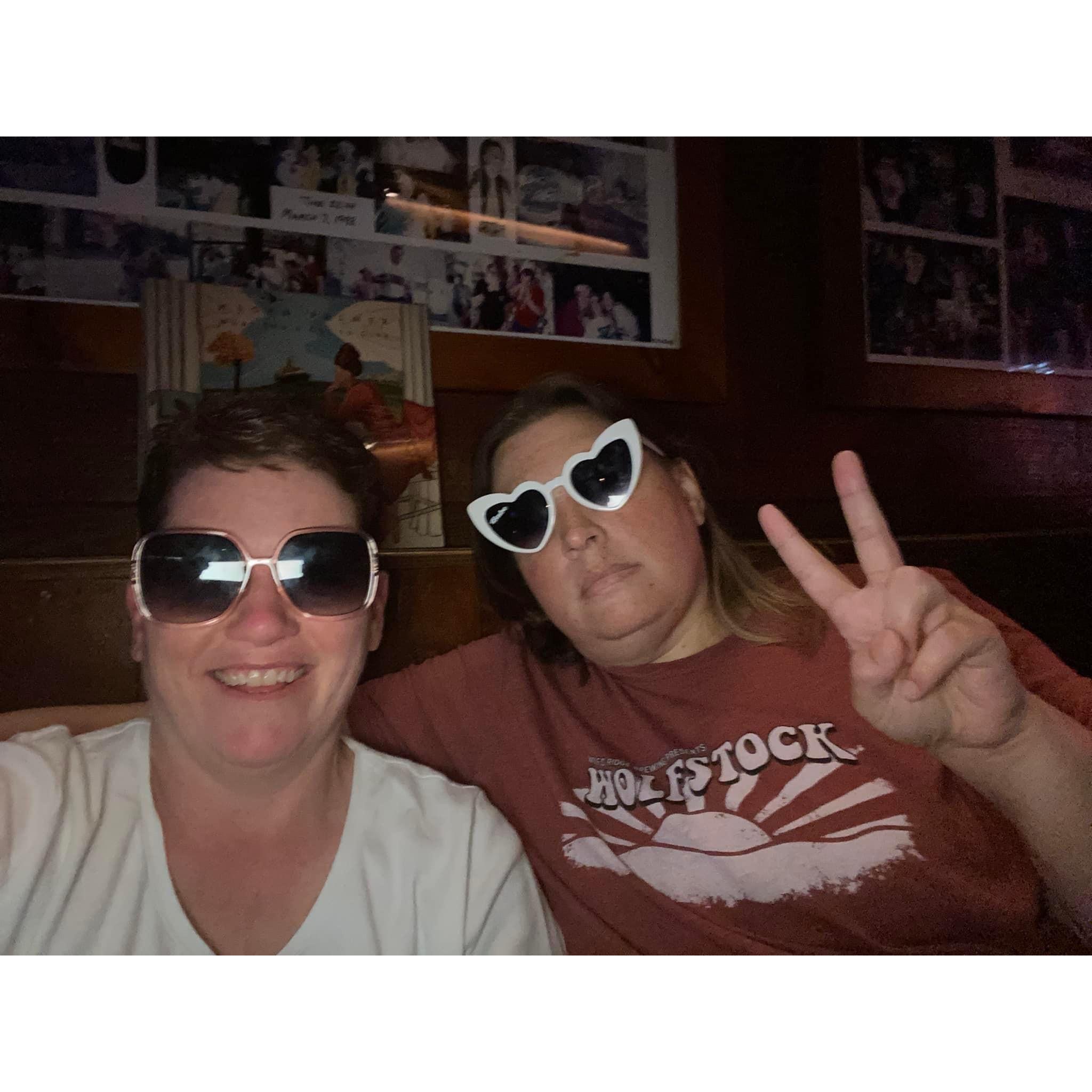 Trying on our friend Megan's sunglasses while we ran the merch table for her show B-)