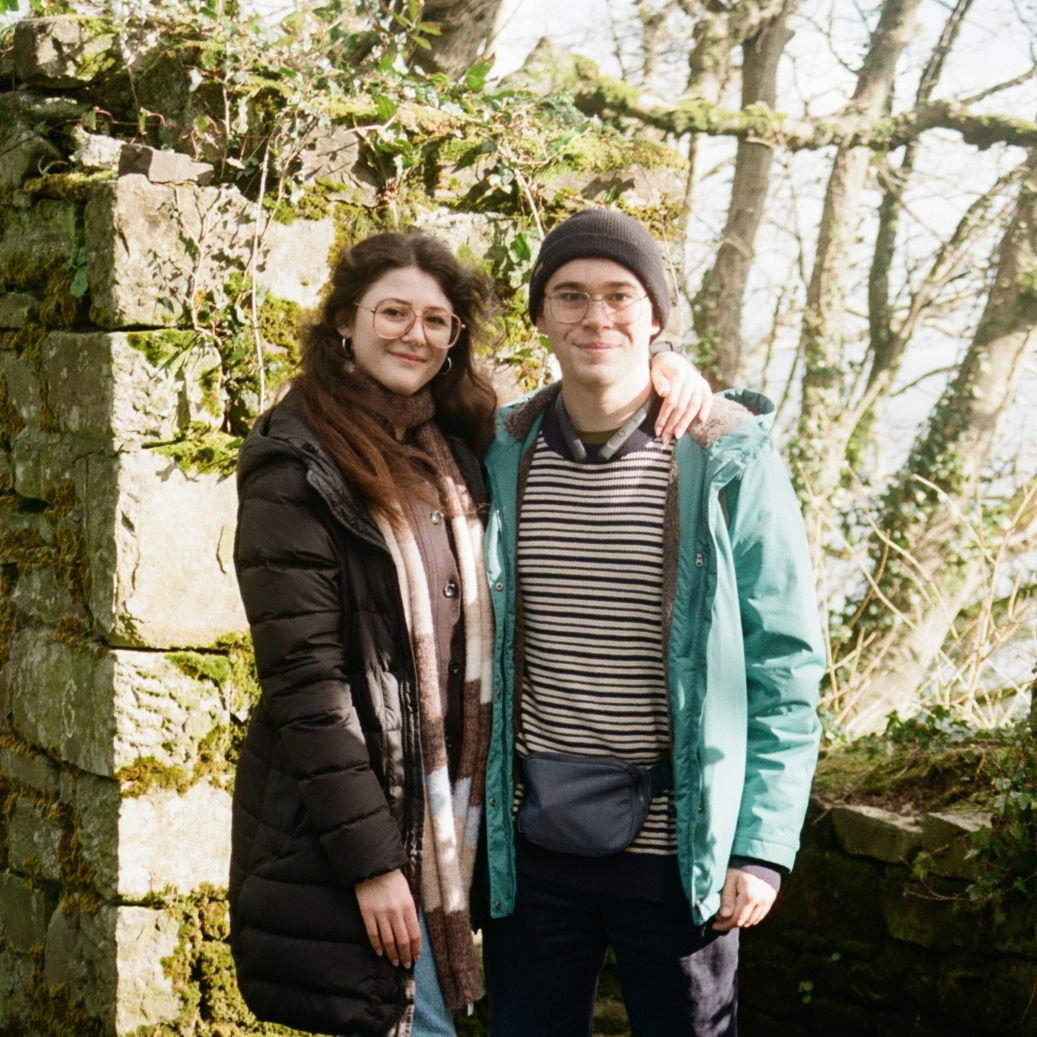 Right after Michael proposed to me on the beautiful cliffs of Saundersfoot, a woman jogging by offered to take our photo.