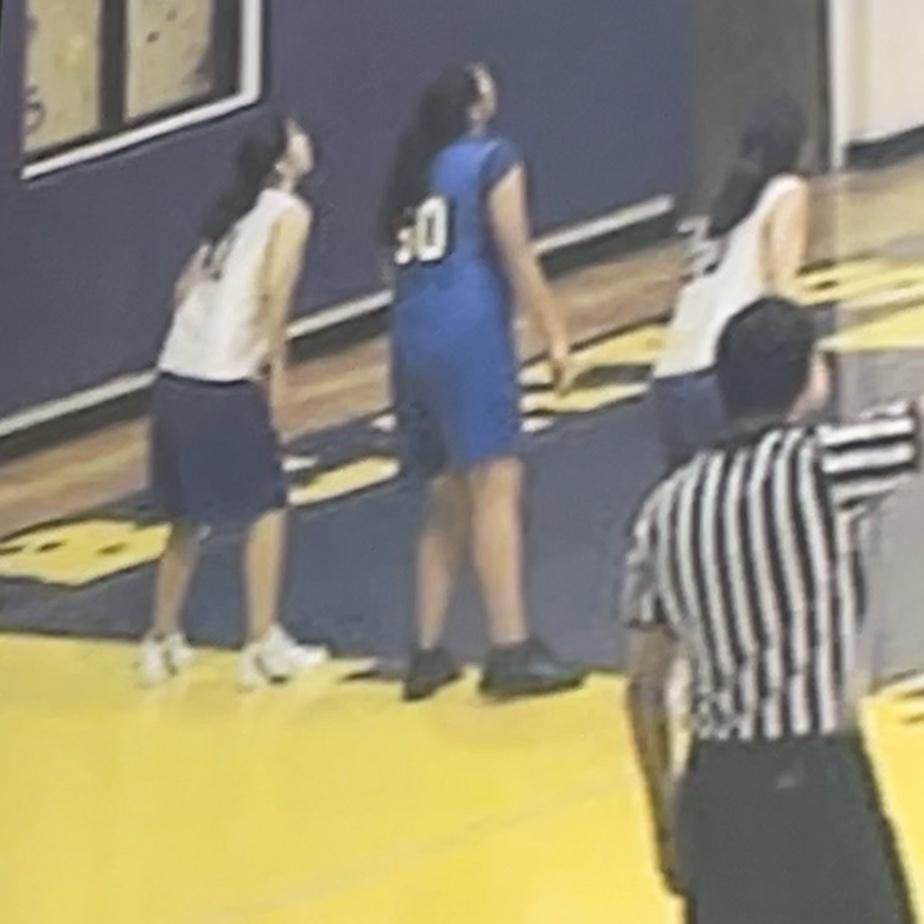 Gabbie(#41) & Renee(#50) in 7th grade playing against each other in basketball.