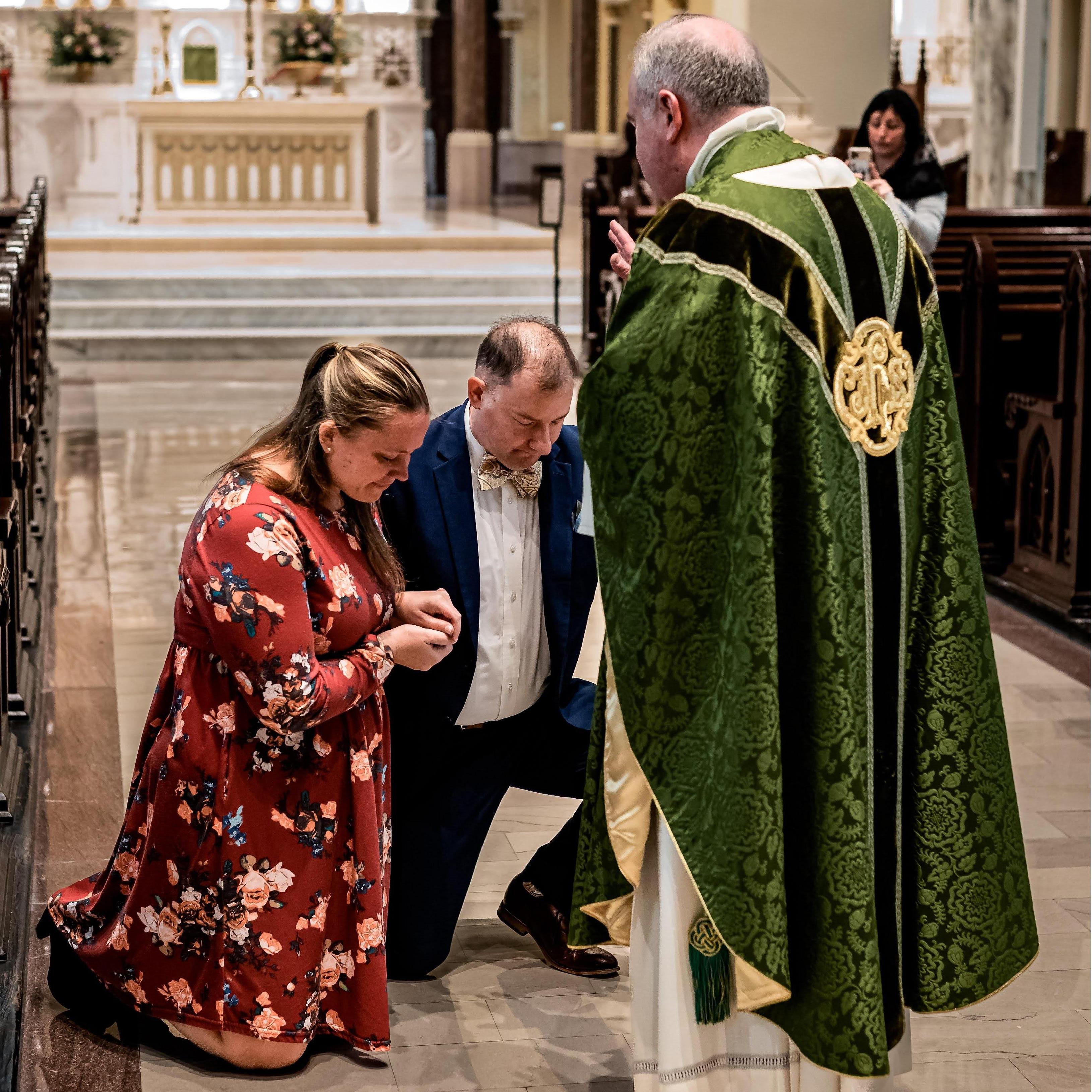 Immediately after Steven's proposal (in the pew where we sat for our first date!), the visiting priest came up to us and offered us a blessing!