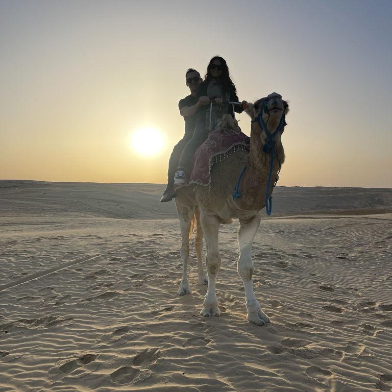 Riding a camel together in Tozeur, Tunisia