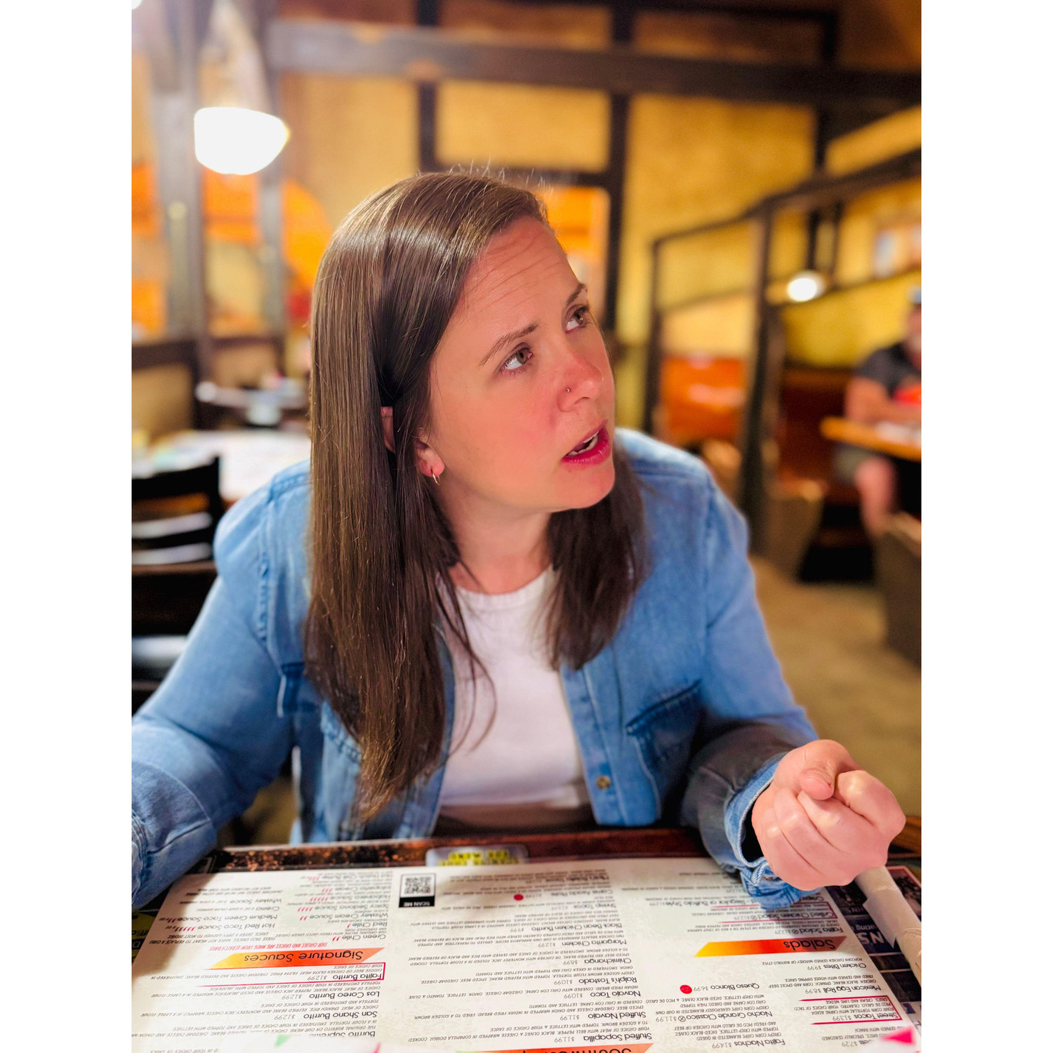 She looks beautiful even when she is ordering.