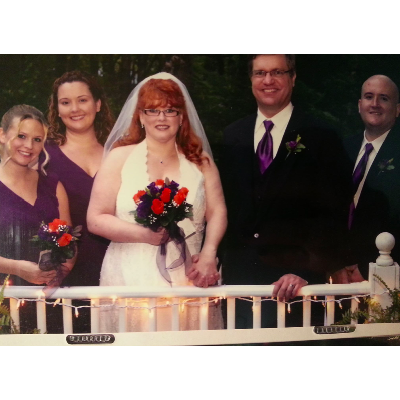 The Groom with family at his mother's wedding in 2013. There are also two future Bridesmaids in this picture!