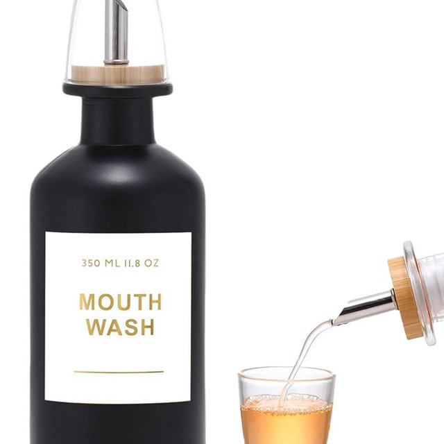 BONLONG 11.8OZ Glass Mouthwash Dispenser for Bathroom with Stainless Steel & Bamboo Nozzle, Mouthwash Cup Reusable, Bamboo Tray, and Elegant Gold Sticker.(Black)