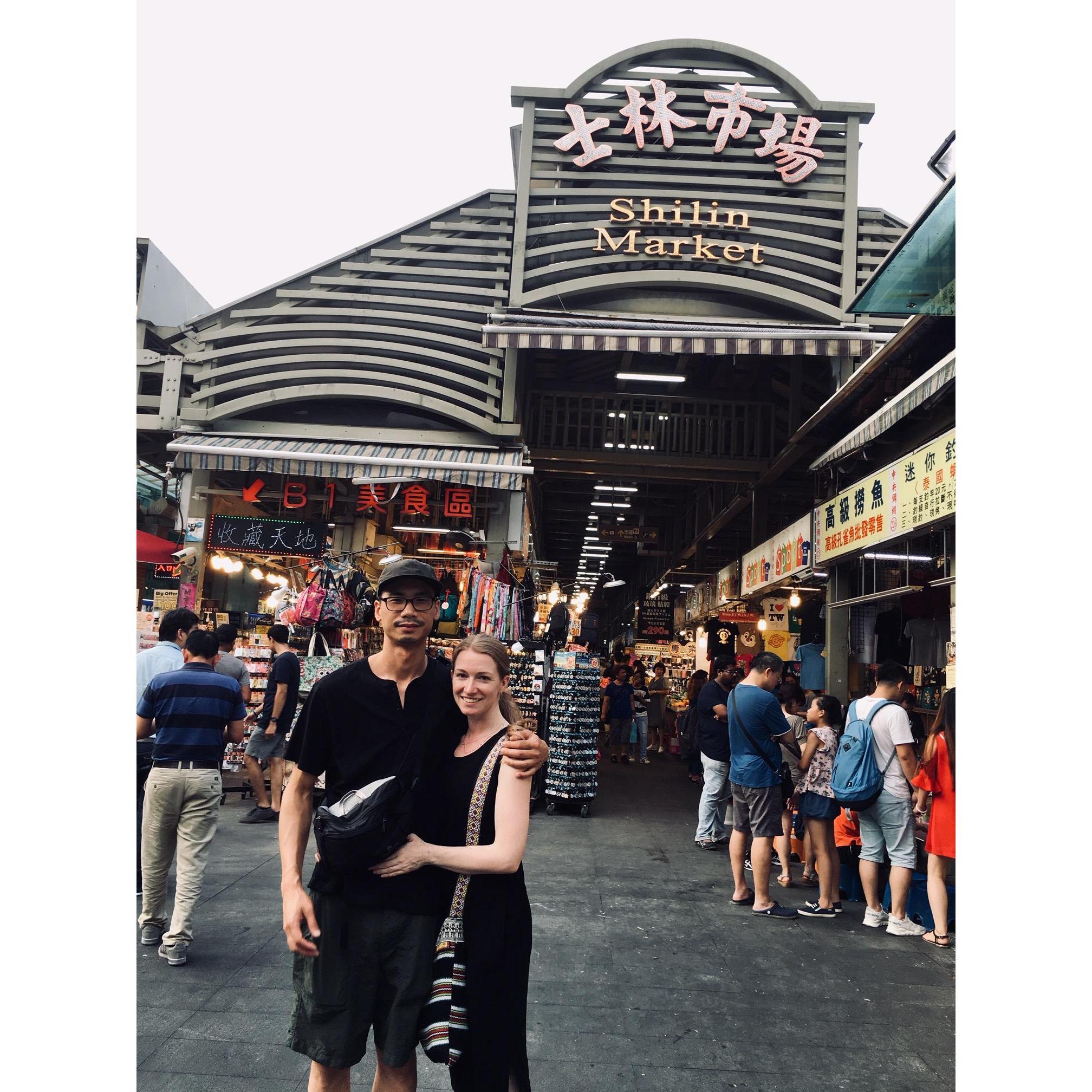 Michele and Henry enjoy the night market. Taipei, Taiwan.