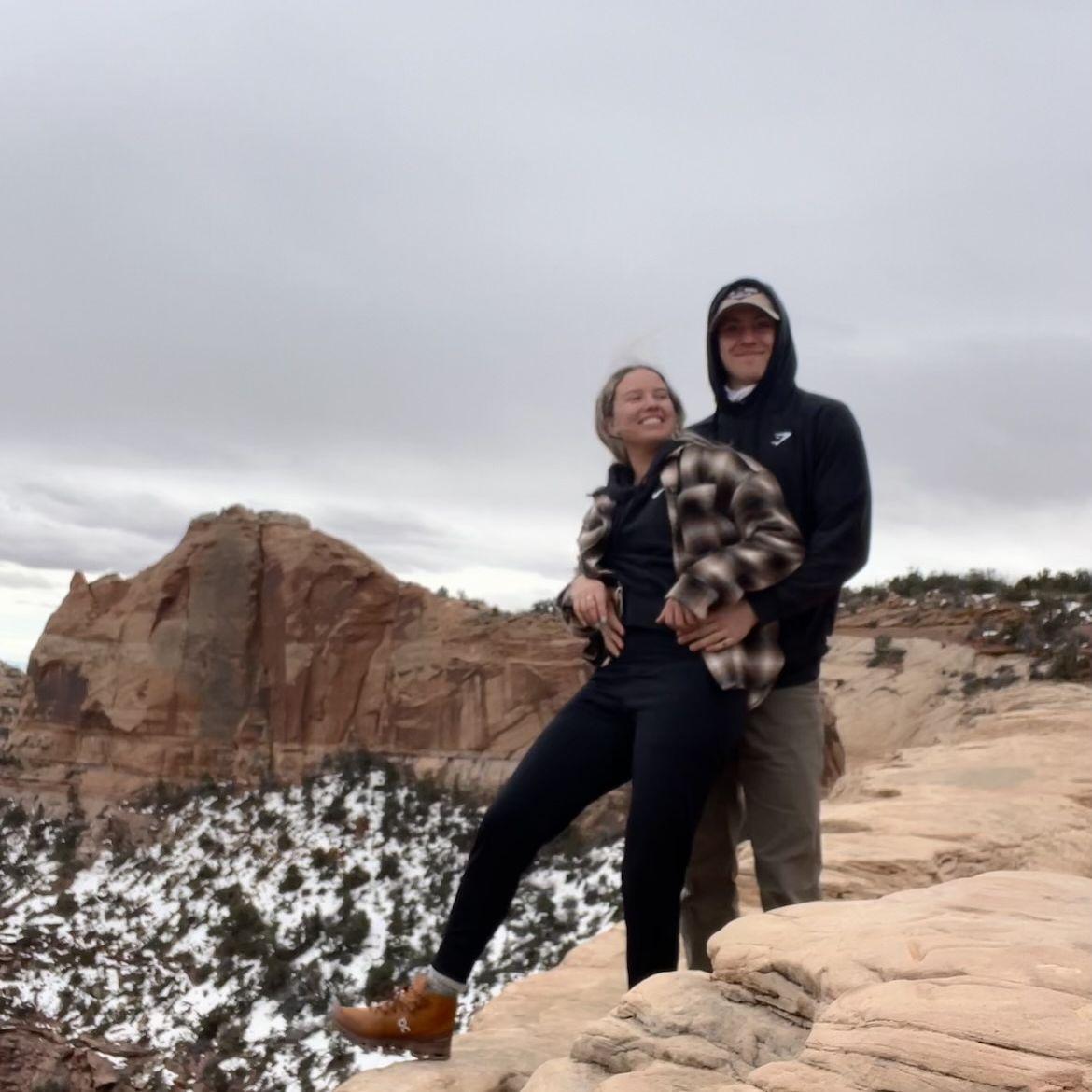 Logan holding Basia back from the edge of a canyon in Canyonlands NP, UT. (2023)