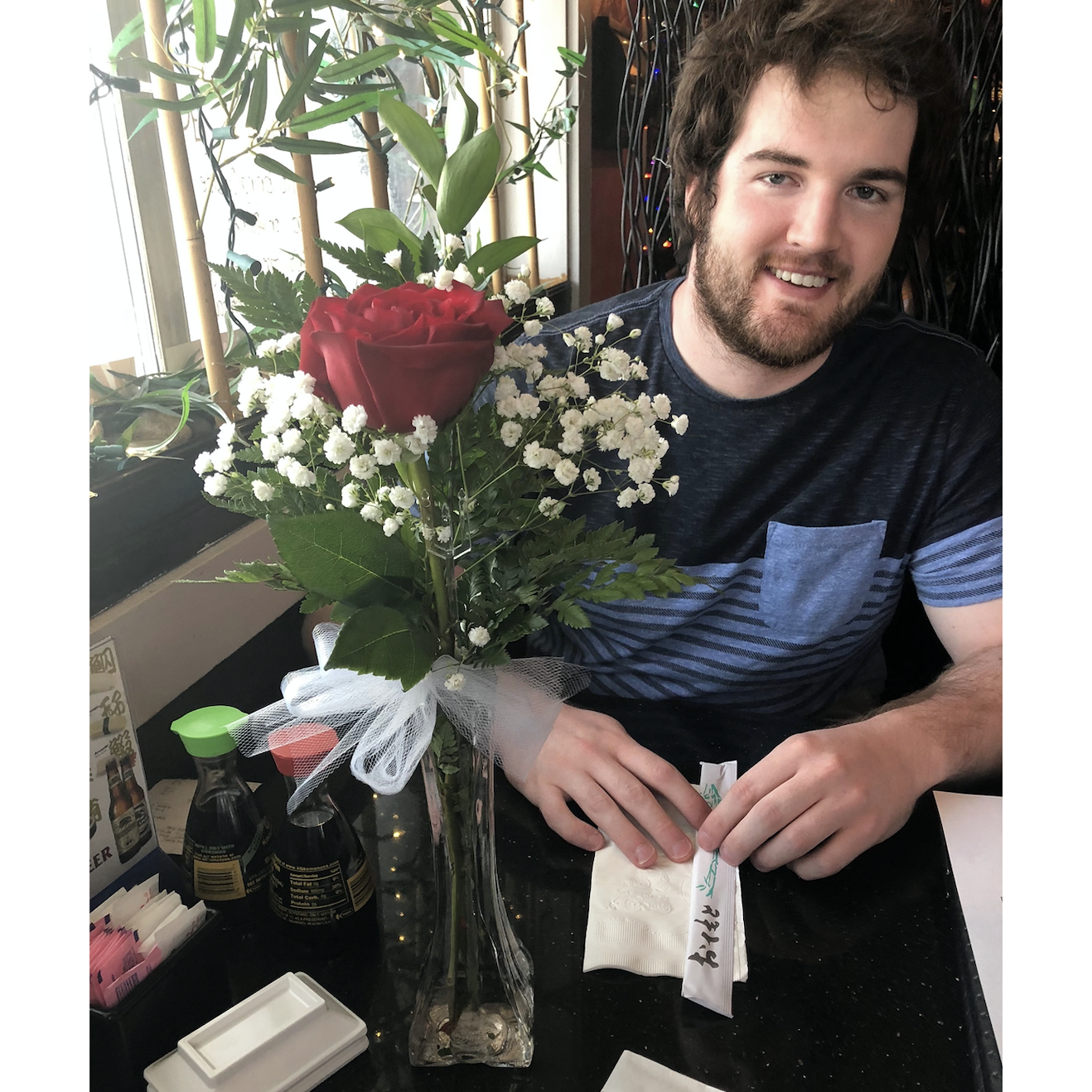 Michael surprised Brooke with a rose and sushi dinner date in Jefferson City, Missouri, 2018.