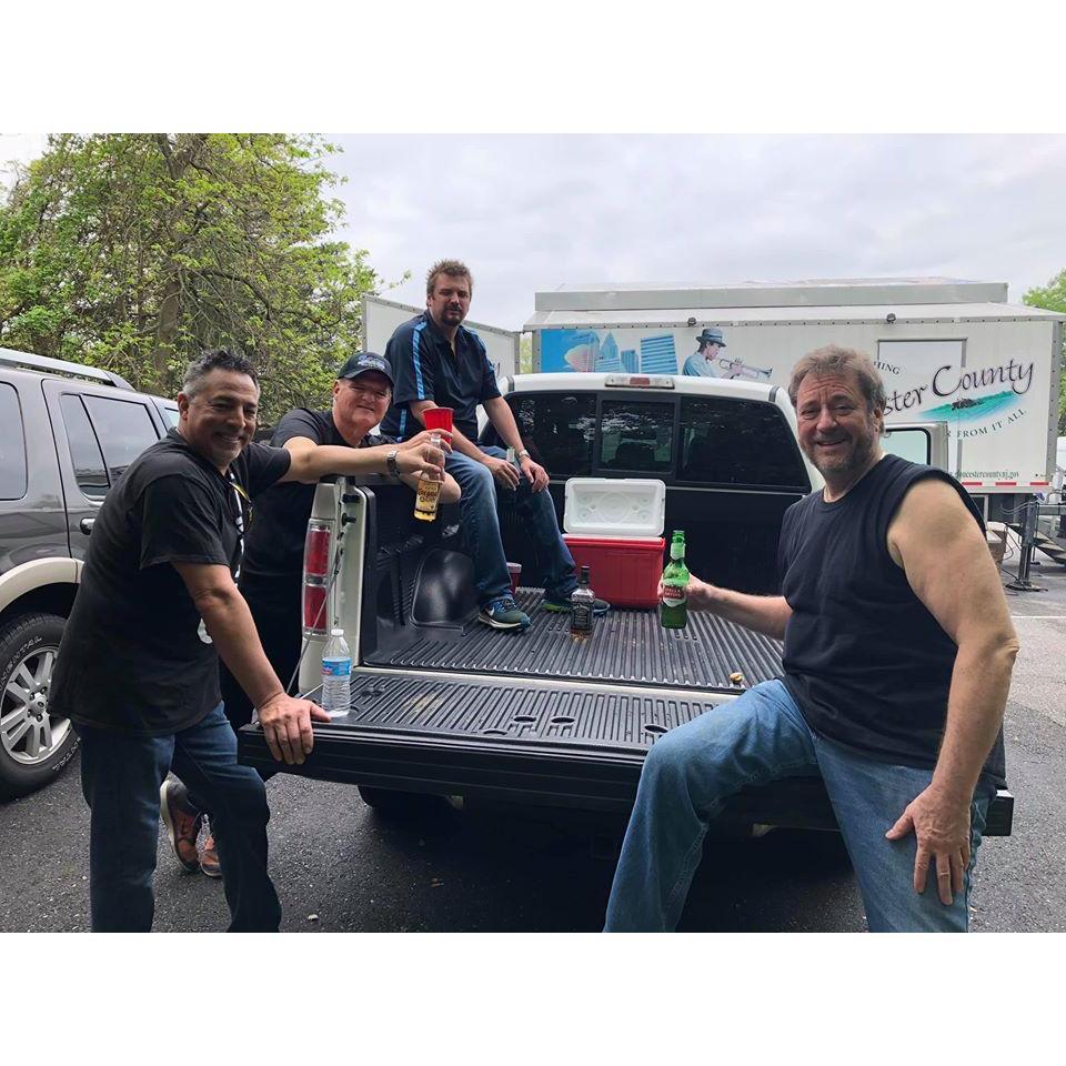The Sass boys pre-gaming redneck style before a gig in the back of Rob's truck.