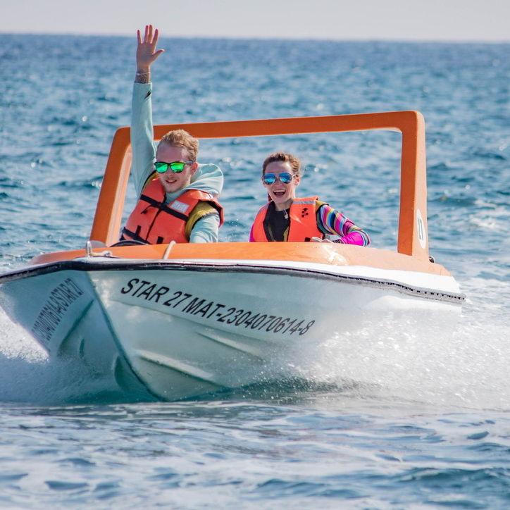 Speed boating on a cruise excursion, so much fun!