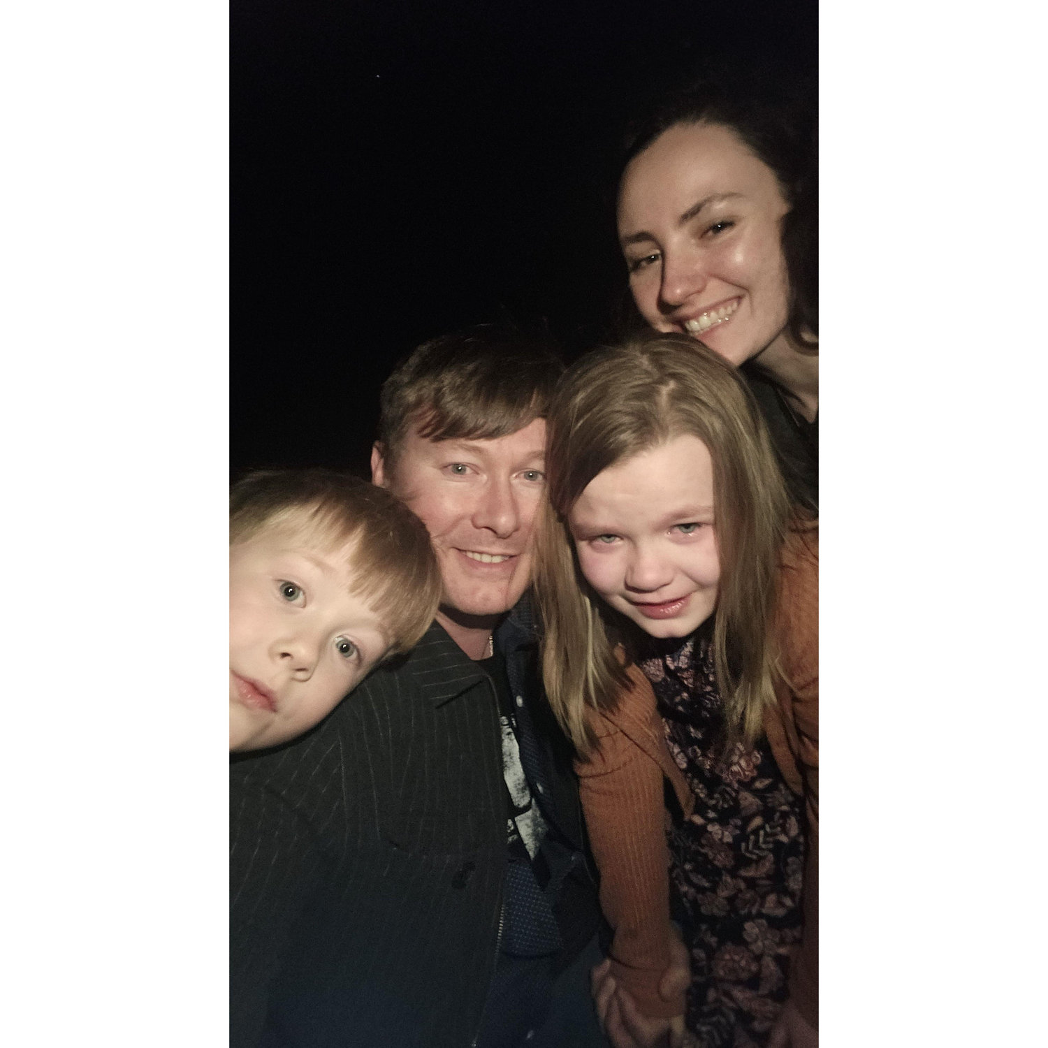 This was the family engagement photo! A Nighttime proposal on the beach. We did not find any shells with our flashlights but we did all agree to be a family.
