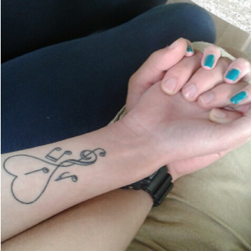 Taken not long after we started dating. He liked my tattoo ;)
