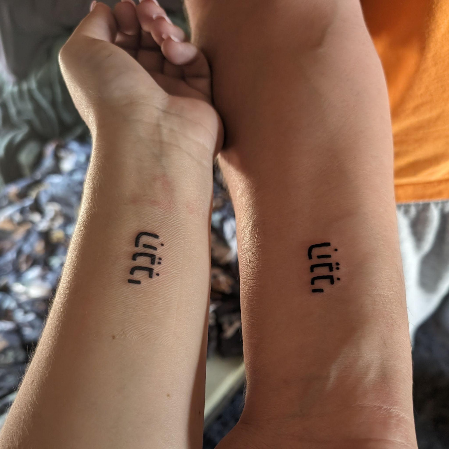 Matching tattoos on our first anniversary- "I Am Here" in Hebrew 04.28.2024