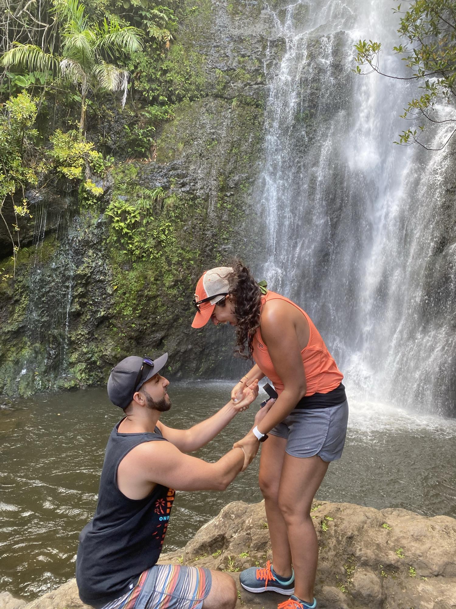 Nick proposing at Wailua Falls on the road to Hana in Maui