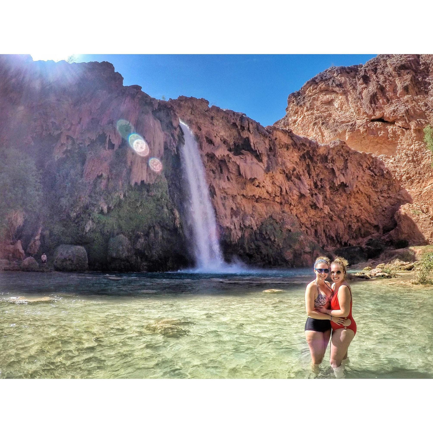 At one of the waterfalls in Havasupai Falls! Our group had an amazing time, but this photo doesn't show the terrifying cliff we had to scale to get there!