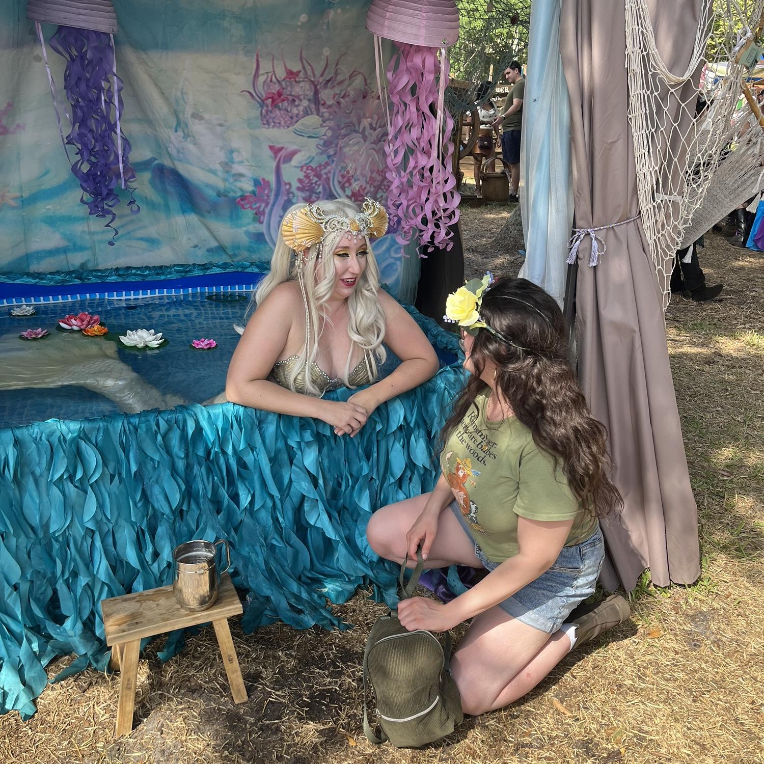 Adam taking a photo of Jacqueline with a Mermaid at the FL renaissance festival, 2022