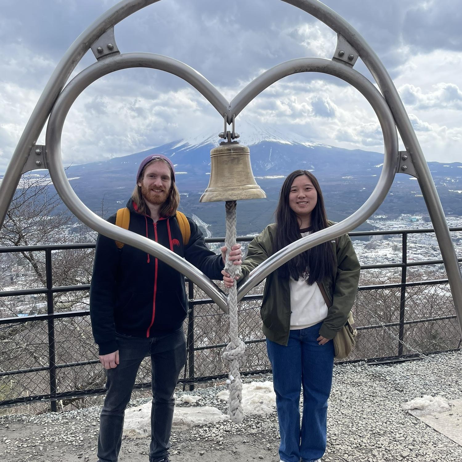 Us at the top of a lookout in Fujikawaguchiko, Japan. Behind us is Mt Fuji!