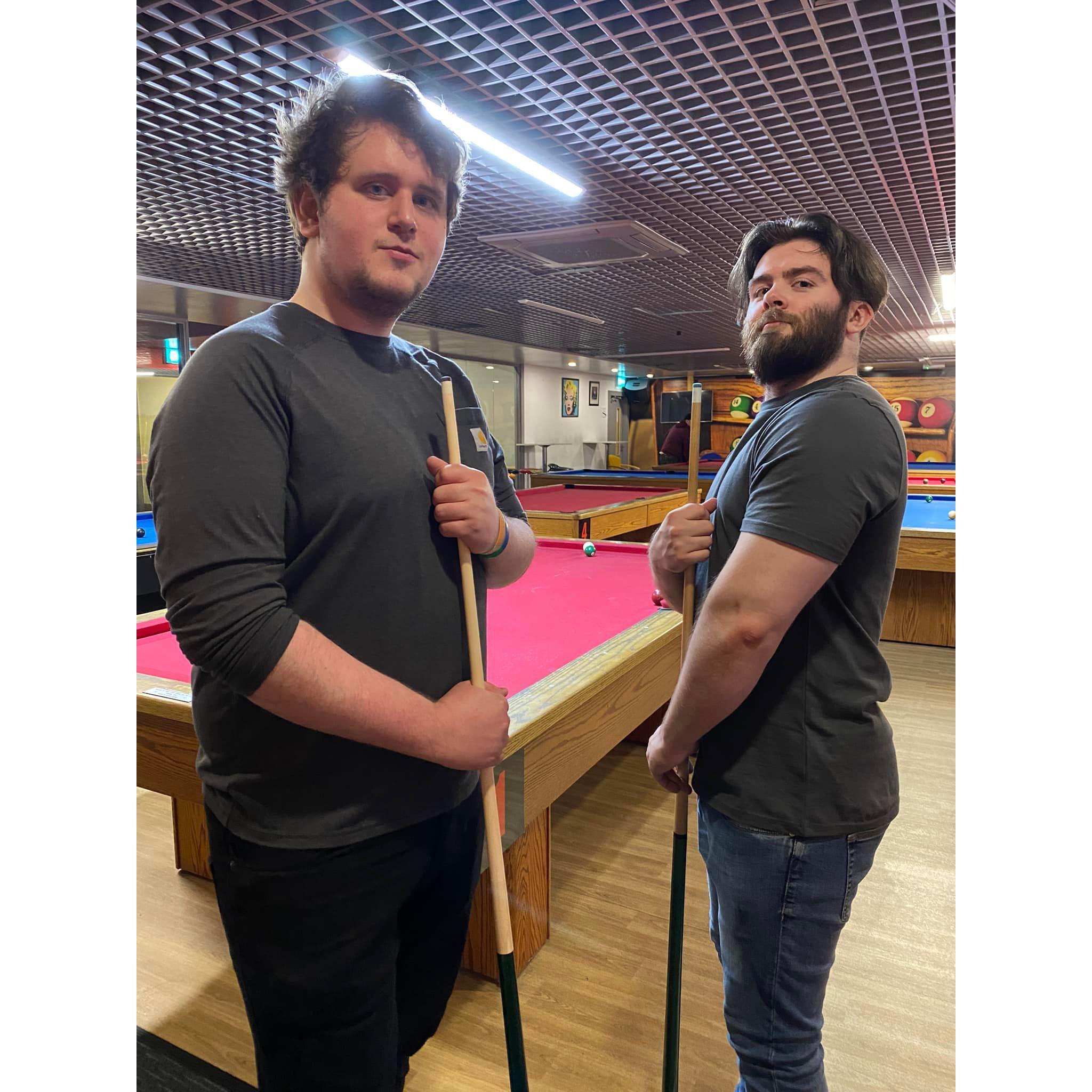The Groom and his Best Man playing pool semi-competitively in 2023.