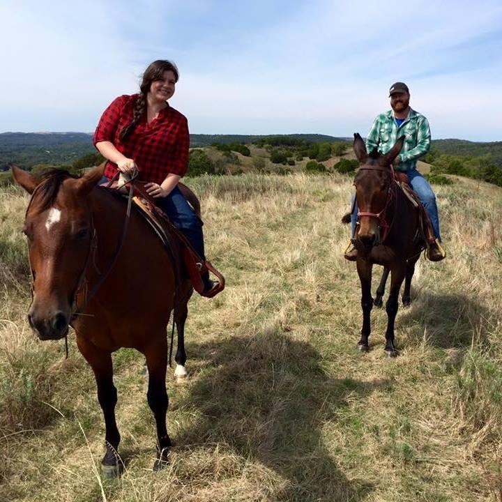 Kyle riding Stormy the mule while I'm on a borrowed horse.