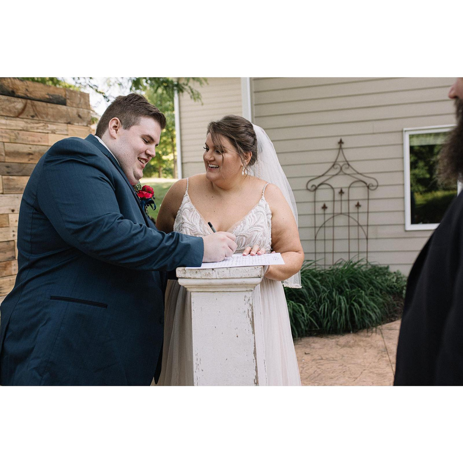 Signing the marriage license.