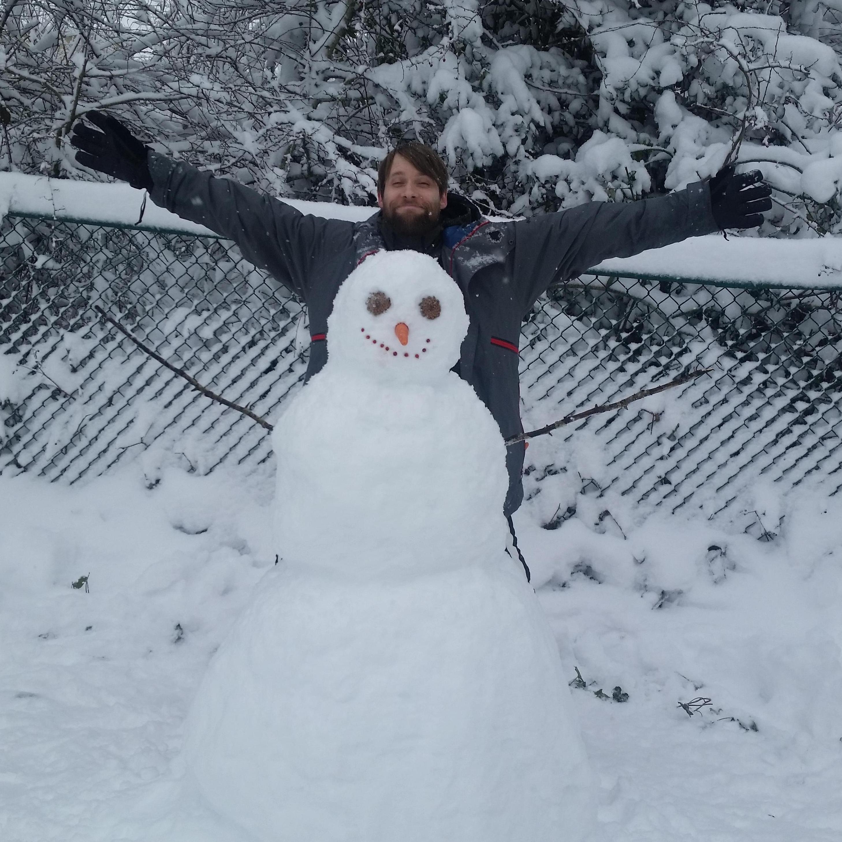 Our first snowman we built together and Budd's first snowman ever