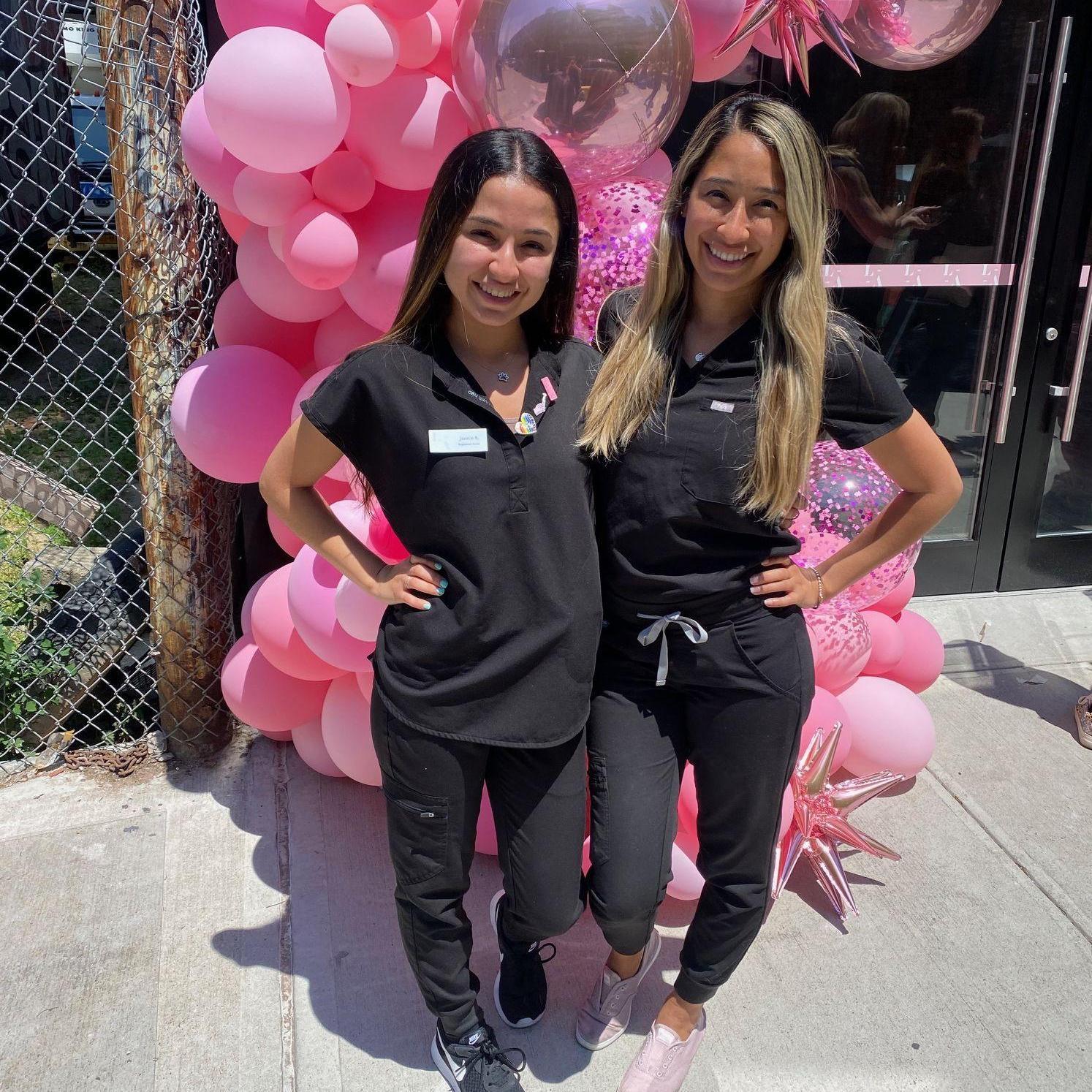 Jackie and her sister (and Maid of Honor) Jasmin showing off their nursing scrubs together.