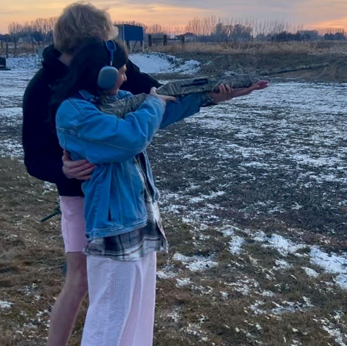 Sam teaching Quinn how to shoot