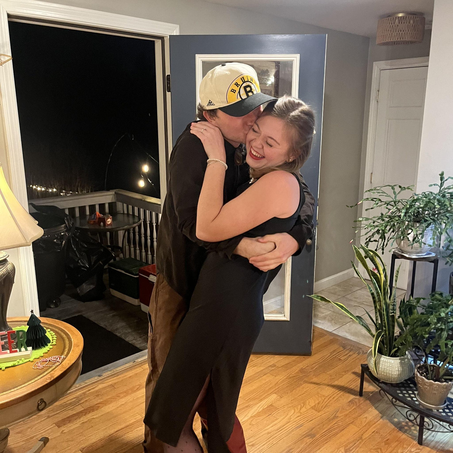 A sweet kiss for the newly engaged couple