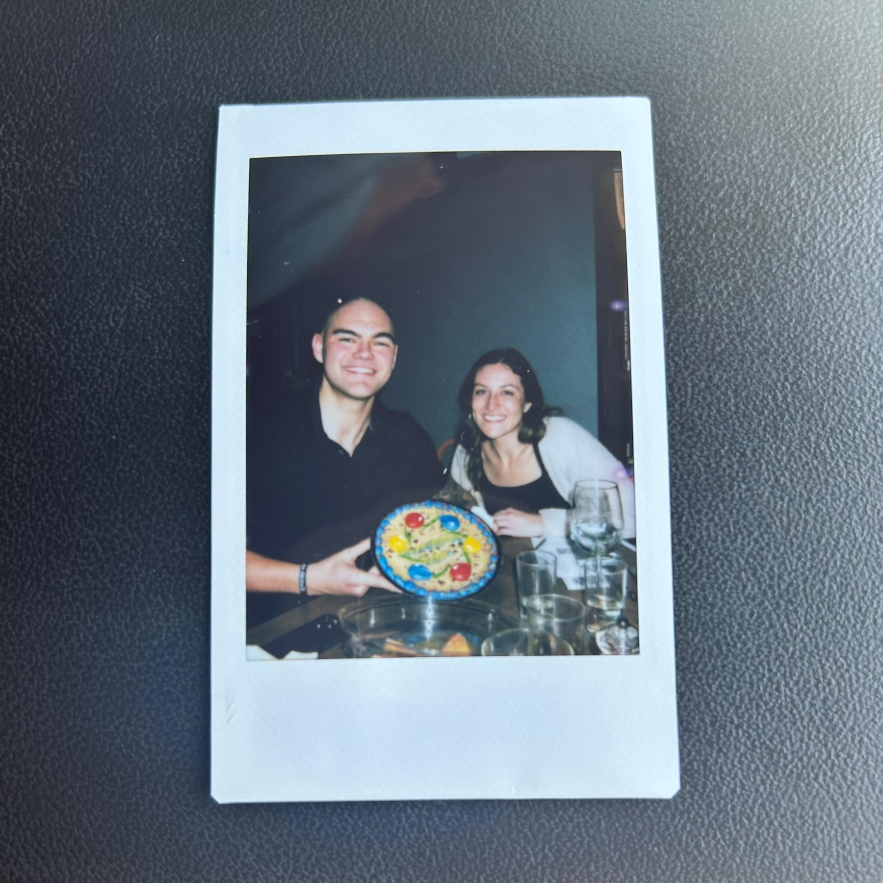 A Polaroid their friend Alex took at Nathan’s 24th birthday dinner. Nathan keeps this photo in his wallet.