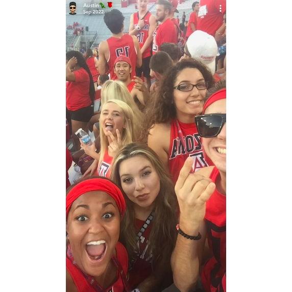 Austin snapping a picture at his first University or Arizona football game not knowing his future wife was in the background. September 10th, 2016