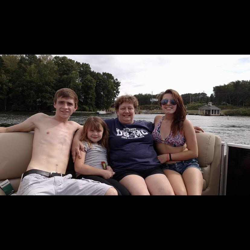 An old throwback of the groom , the made of honor , the mother of the bride and the bride at Ronnie’s lake house .