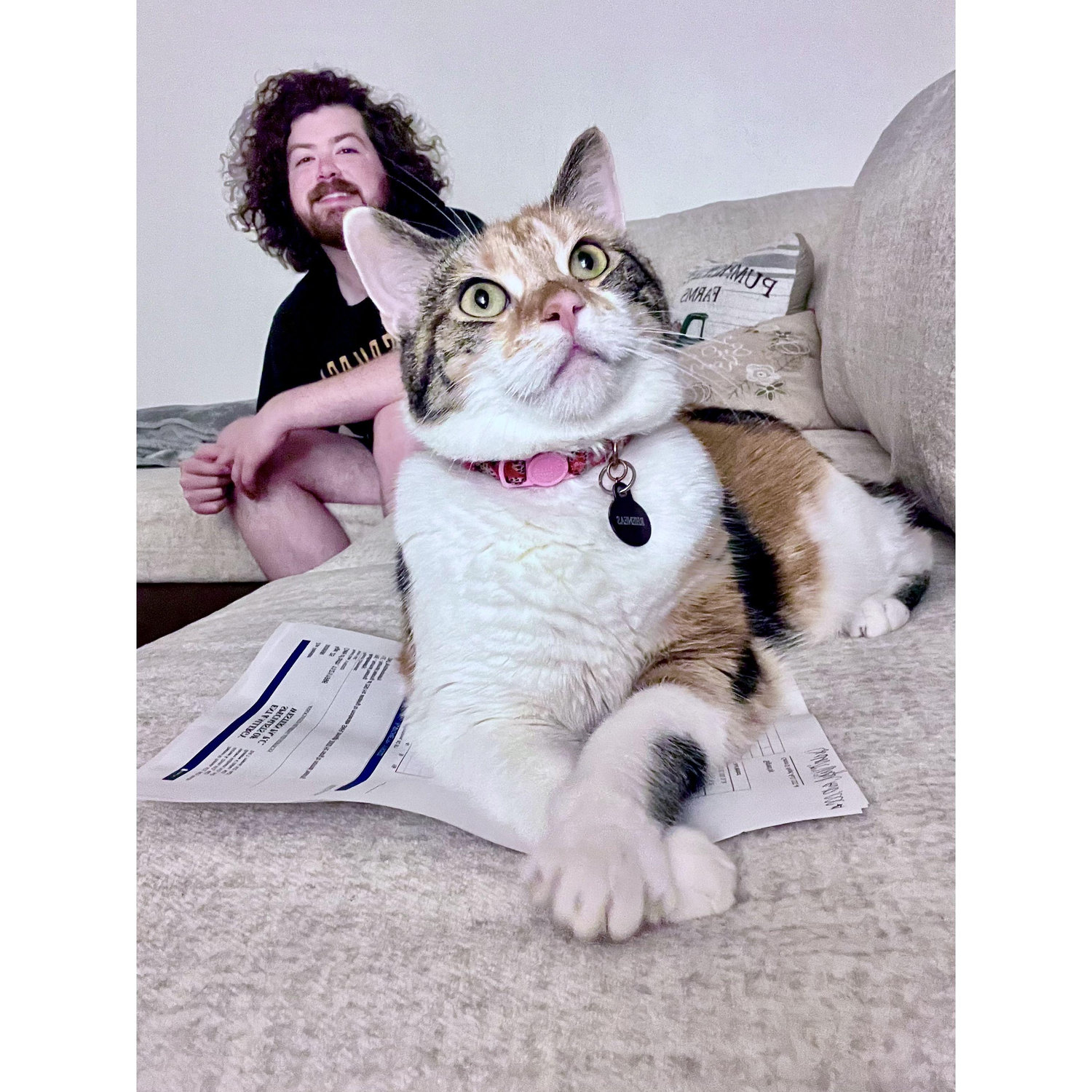 Matt & Rheneas (she's sitting on Zoe's hearing test results). The results were bad, the cat was good.
