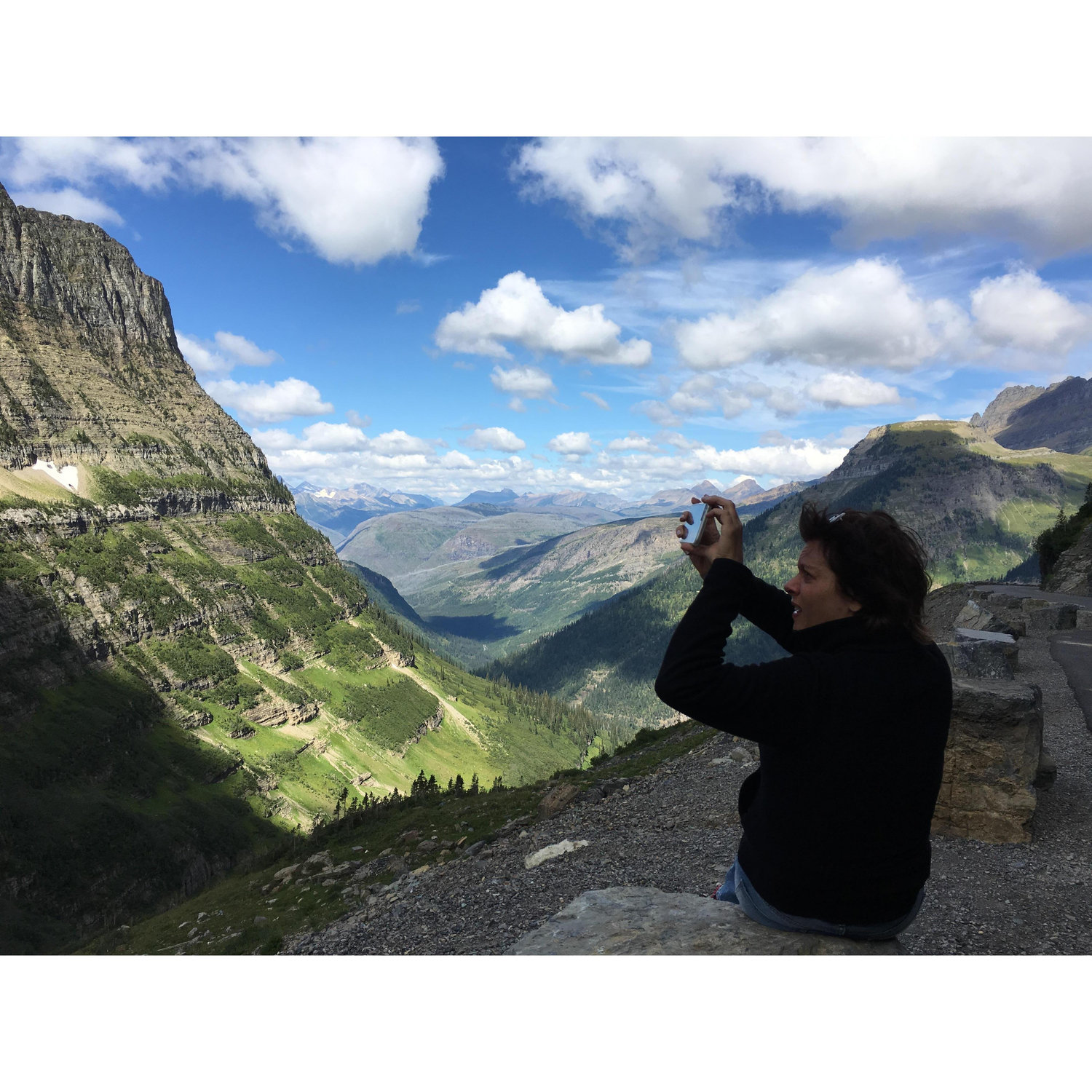 Robert capturing Lisa capturing a shot on the Going-to-the-Sun Road in Glacier.