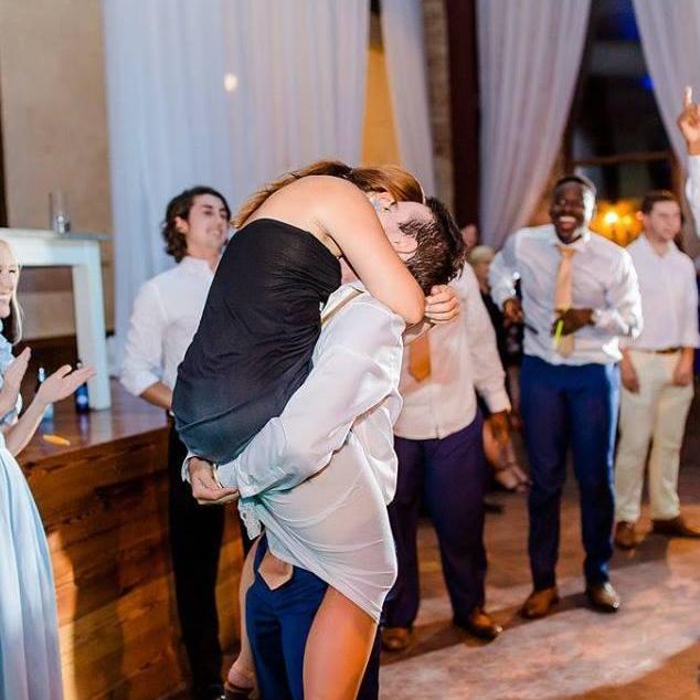 This was taken right after Mark caught the garter at our friend Megan's wedding. Little did I know he would propose a few weeks later.