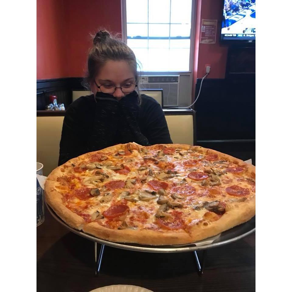 A pic of me and our giant pizza in Philadelphia! What an adventure that trip was