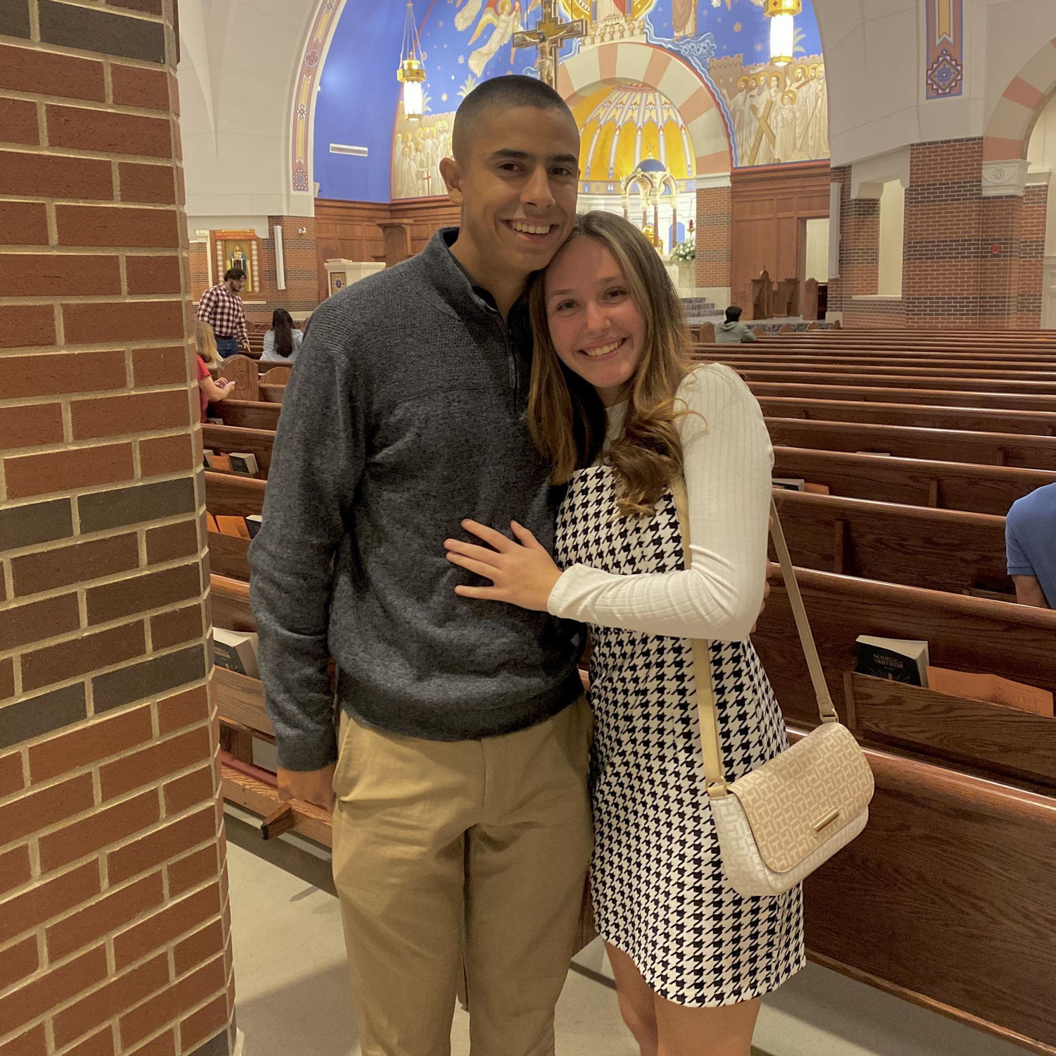November 19th, 2023; This photo was taken after a 6pm Saturday mass. We were almost done with our first semester at A&M and had been dating for almost 6 months.