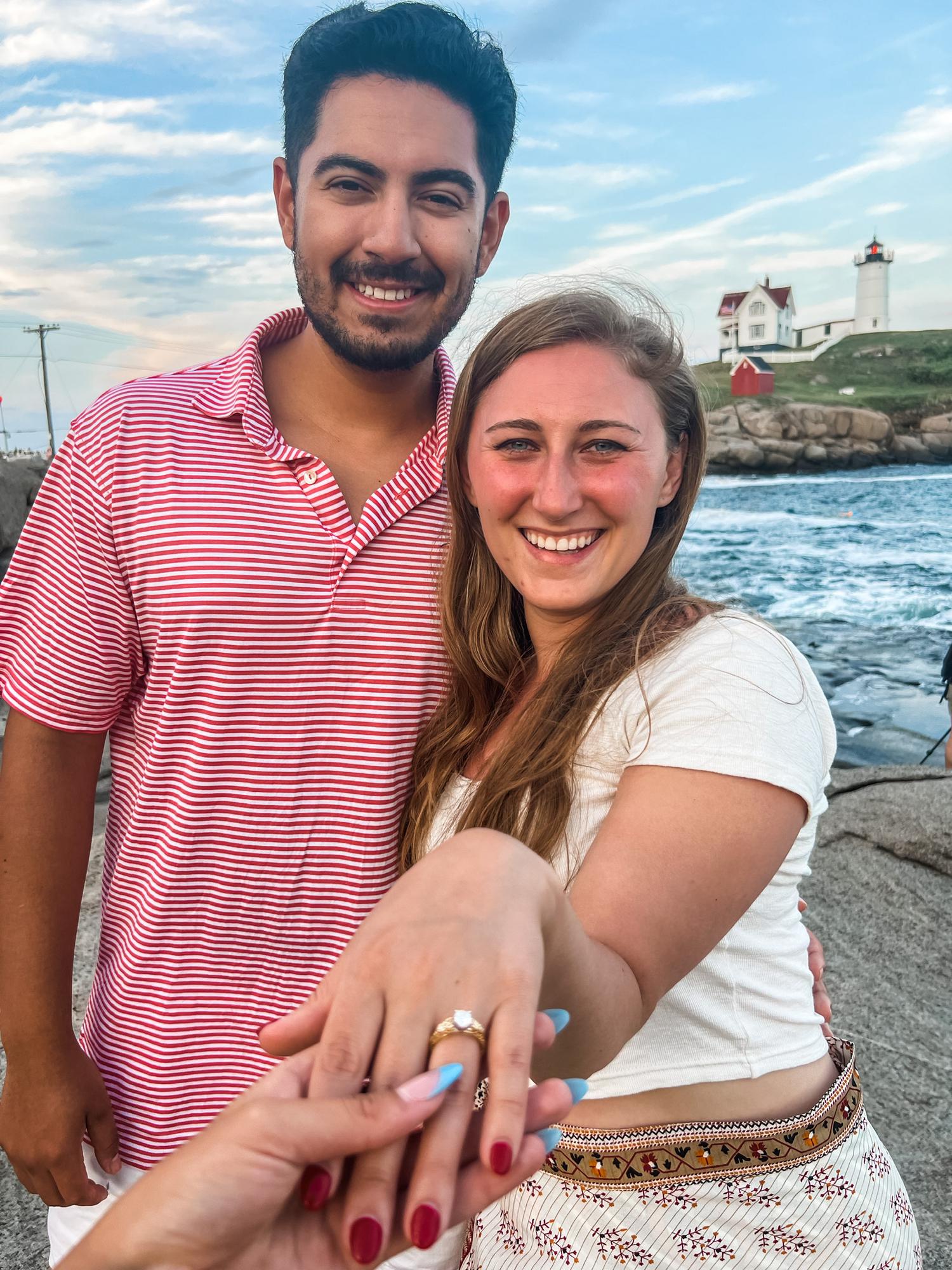 Mallory showing off her engagement ring after Esteban proposed to her at Nubble Light