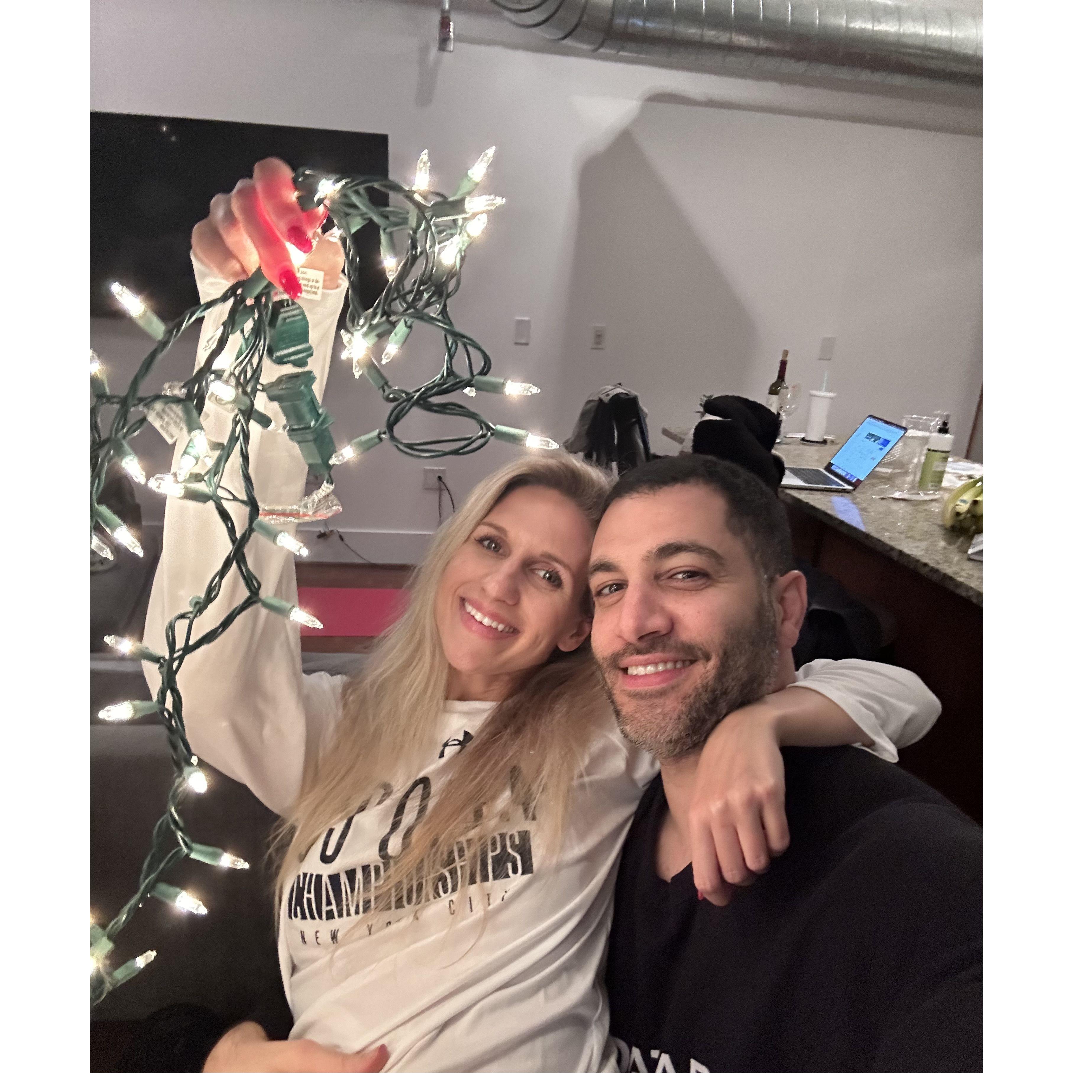 Decorating the Christmas tree for the first time.  The lights ended up being a bit lopsided on the tree because we didn't have enough, but we had a great time.