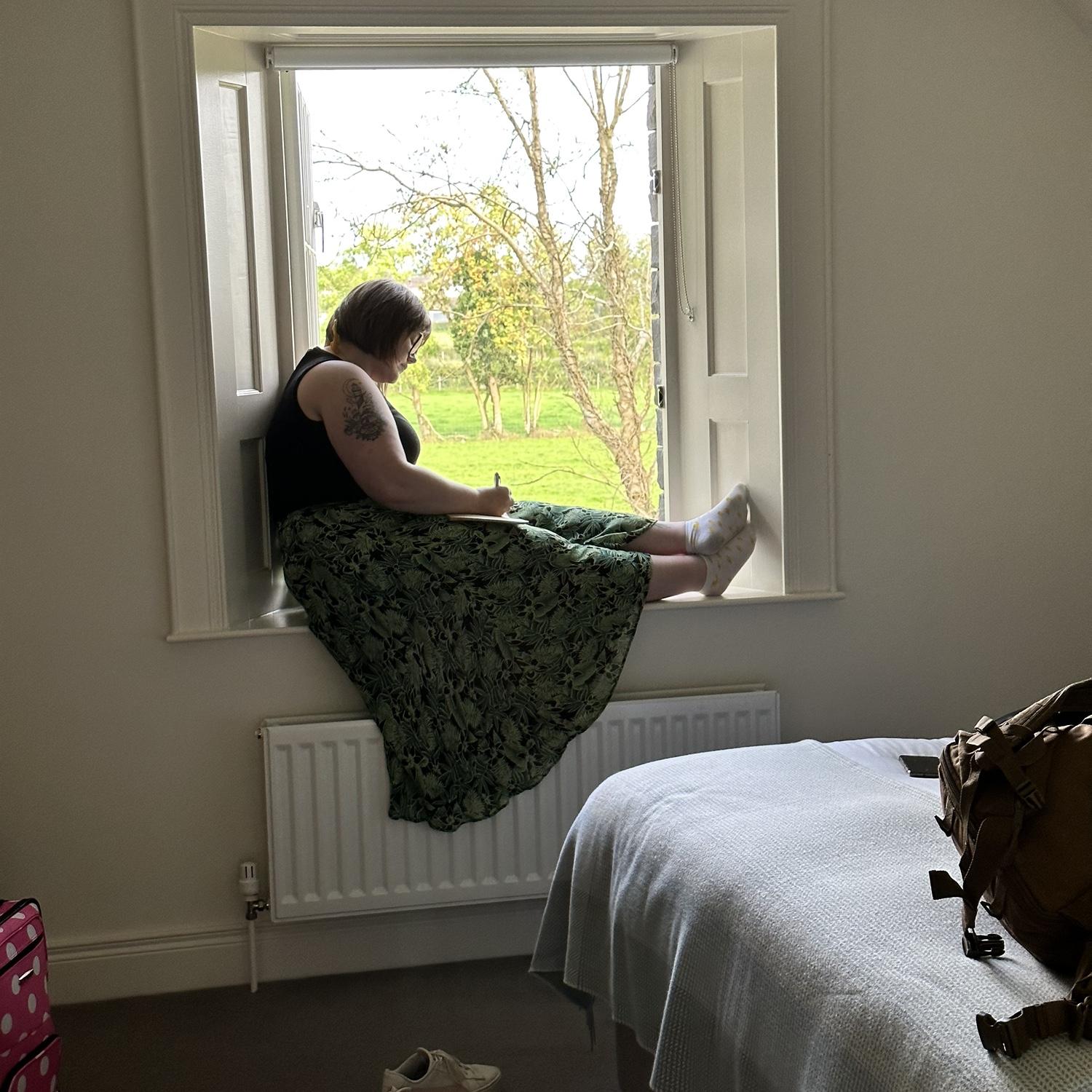 Brody caught this photo of Erica journaling in Meigh, Northern Ireland. He said it looked artsy.