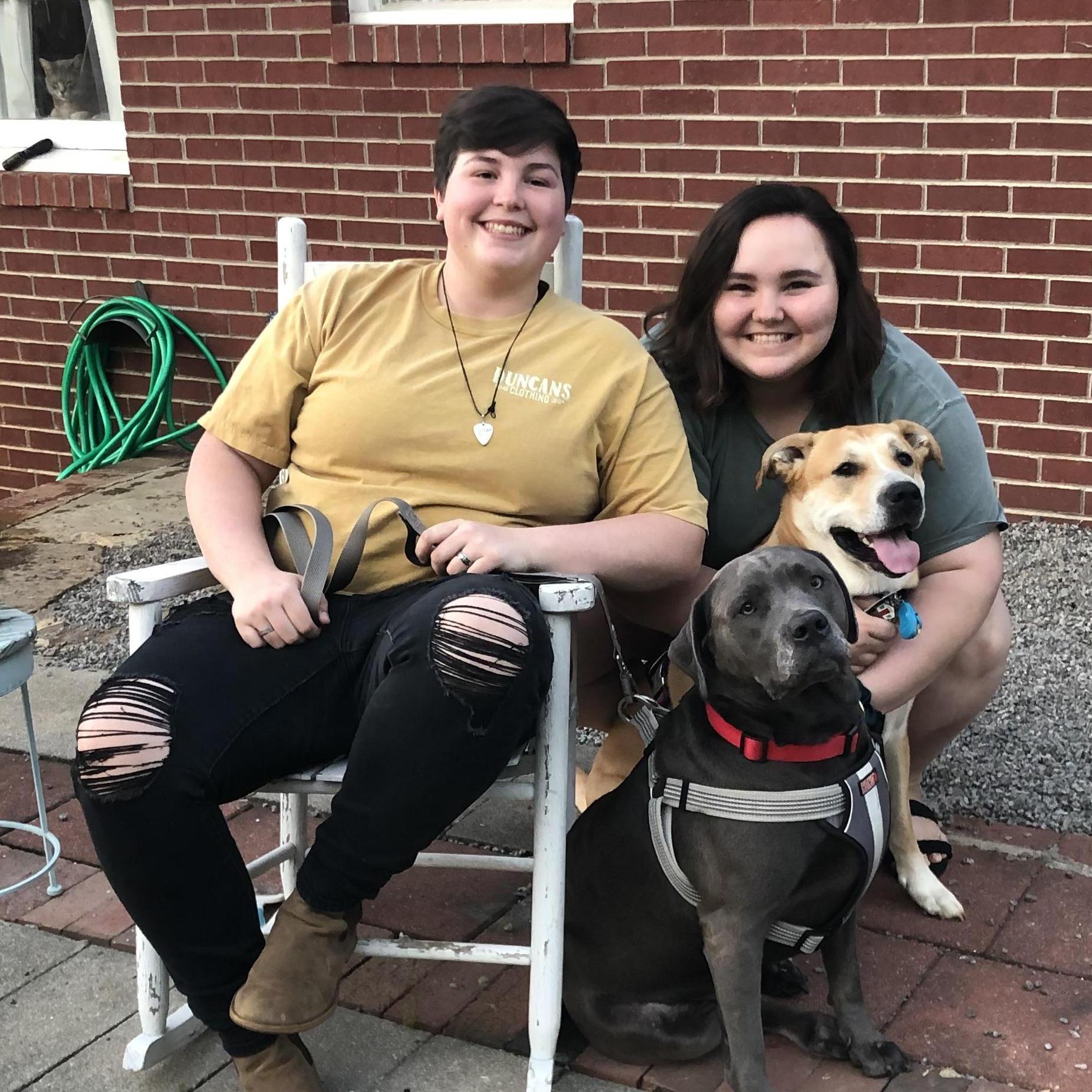 Our family includes our baby Charlee (Grey) and our niece puppy Bailey (Tan)