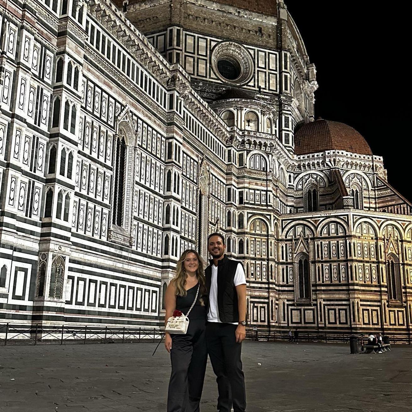10.9.2023. Travel. Daniel and Emily outside the Duomo in Florence after Daniel bartered with a local and bought Emily a rose.