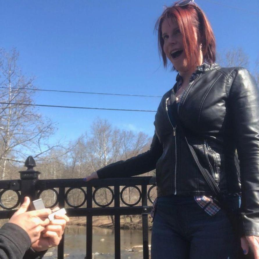 Matt surprising Jackie with an engagement ring on "their bridge" in Old Ellicott City