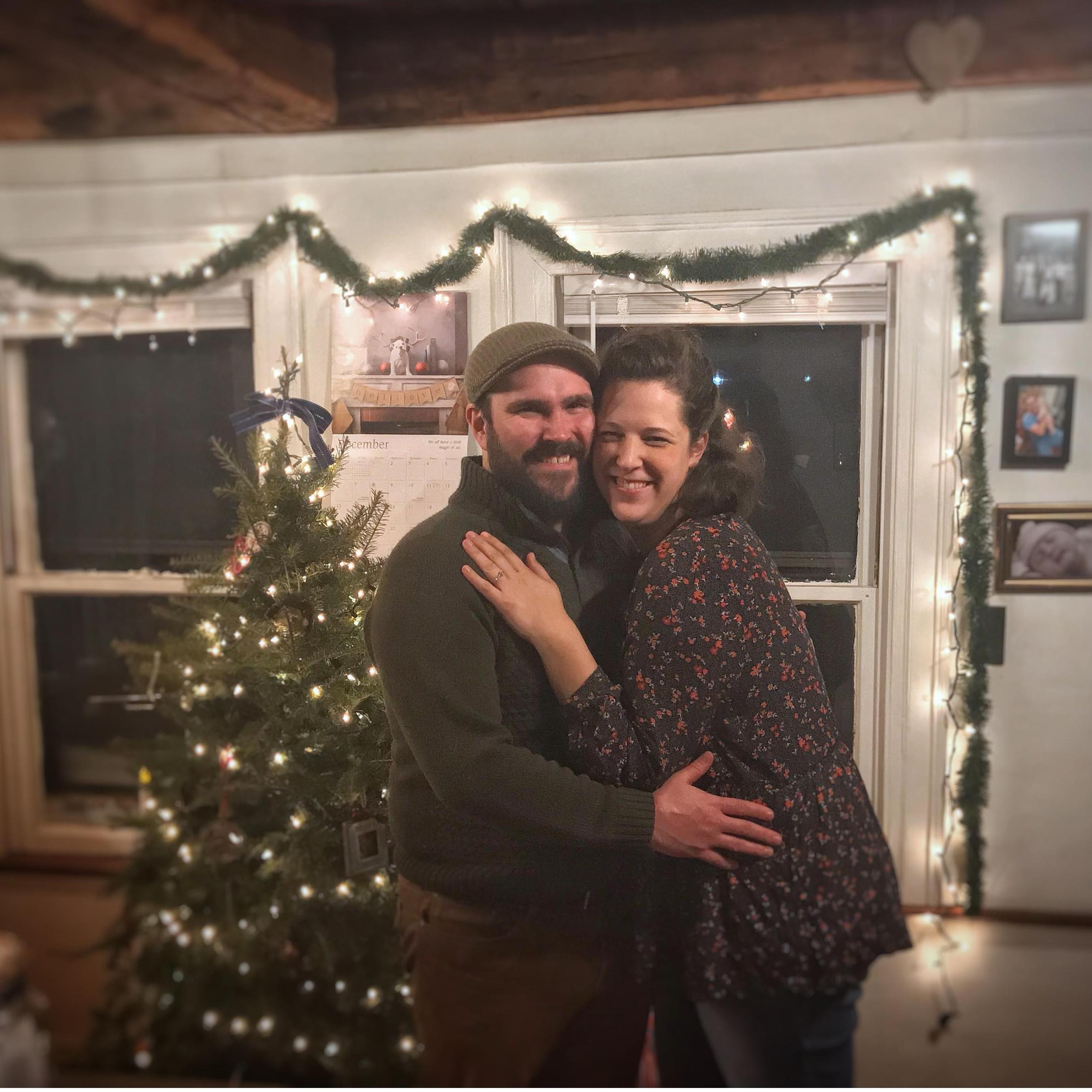 The night we got engaged, standing in the kitchen next to our first living Christmas tree. December 2020.