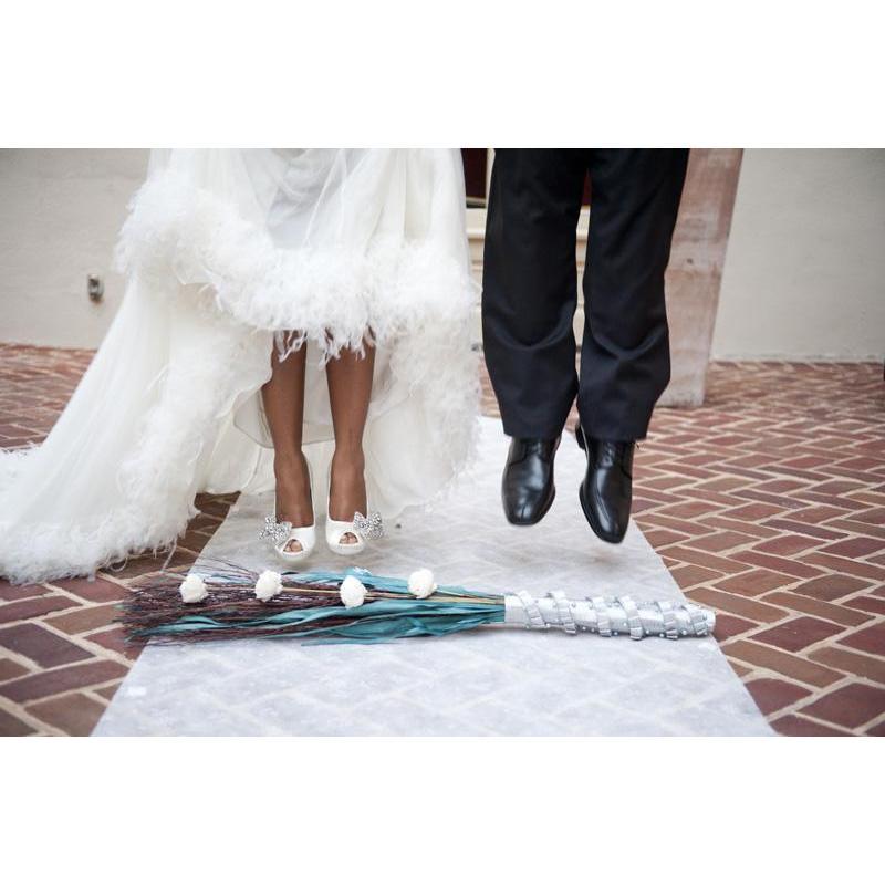 Slaves weren't allowed to get married so instead they jumped the broom to signify their union. The handle is strength, the bristles are family, and the ribbon is what ties our love together.