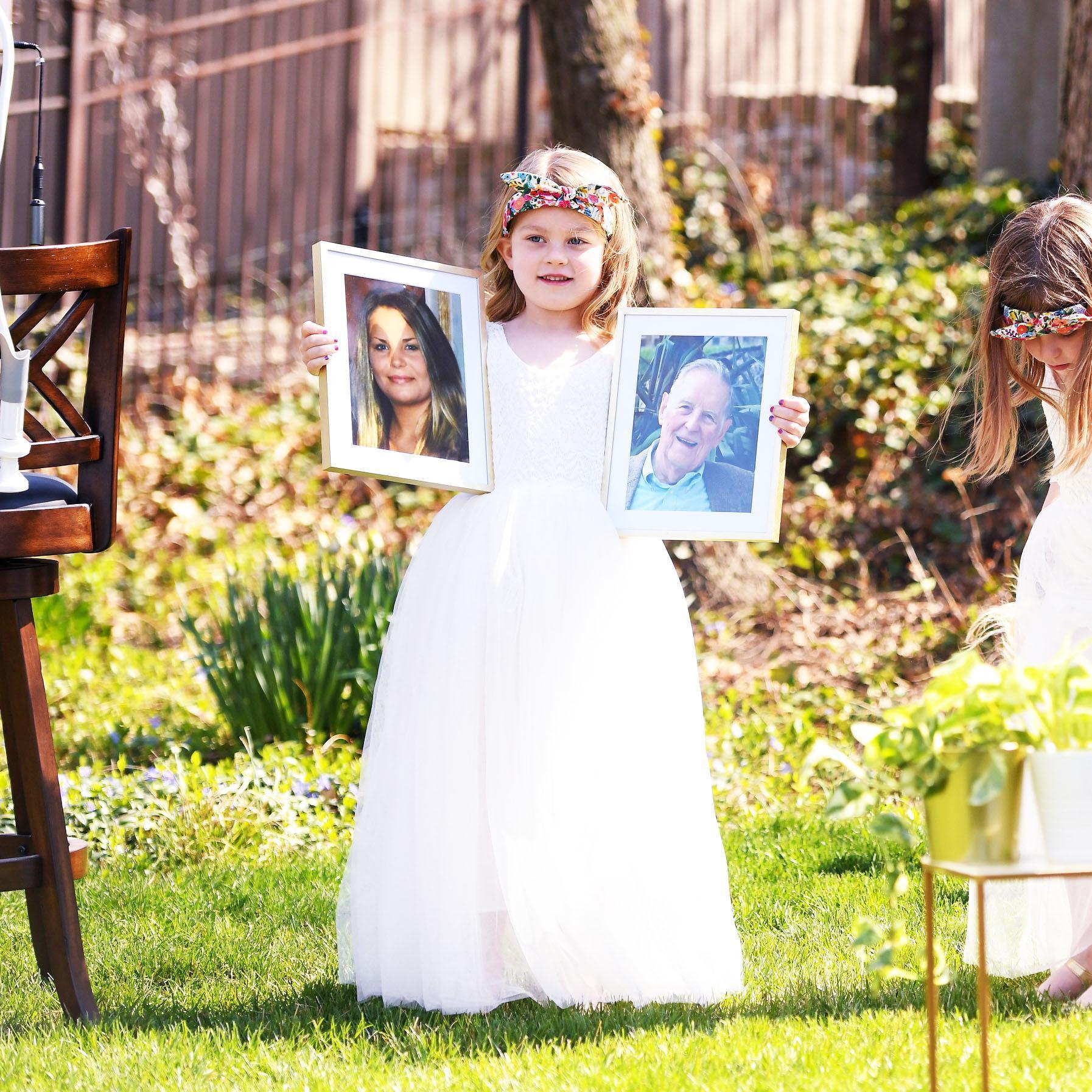 Zoe Hood carried pictures of Ryan's step-sister, Kelsey Thornton, and Laura's grandfather, Bill Markey, and we know we have them to thank for orchestrating the beautiful weather.