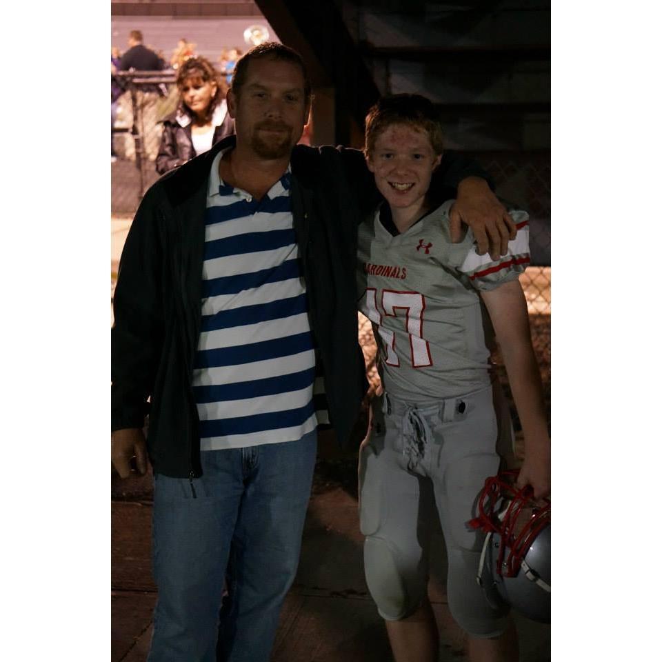 Two men bonding over football. Nothing like a father/son relationship!